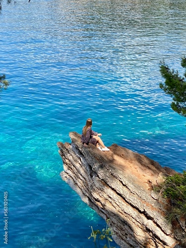 Person on the rock with amazing natural view, concept of recreation, relaxation, neauty of nature and human.	 photo