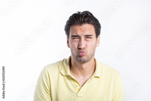 Close-up portrait of funny man with closed eyes and kiss isolated on white background