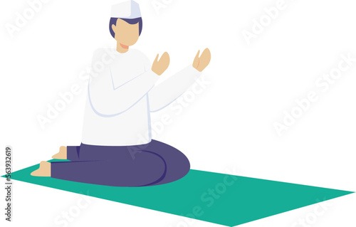 a man wearing a white koko shirt and navy blue trousers equipped with a cap is praying after completing his prayer service on a green prayer mat
