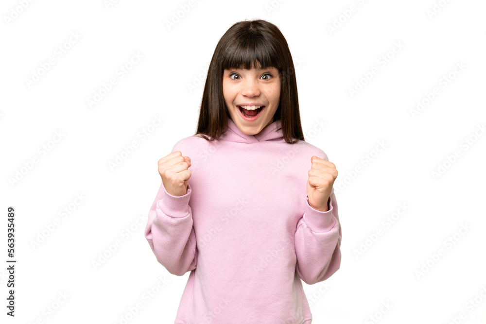 Little girl over isolated green chroma key background celebrating a victory in winner position Little girl over isolated green chroma key background celebrating a victory in winner position