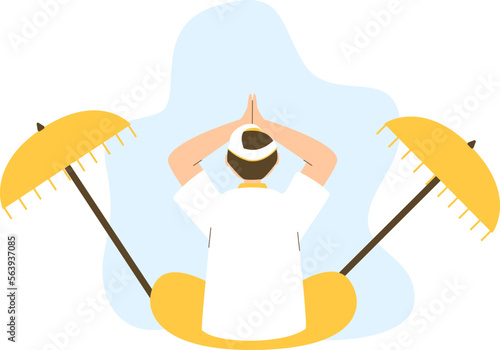 a brown-haired man wearing yellow and white worship clothes was sitting praying equipped with two yellow umbrellas
