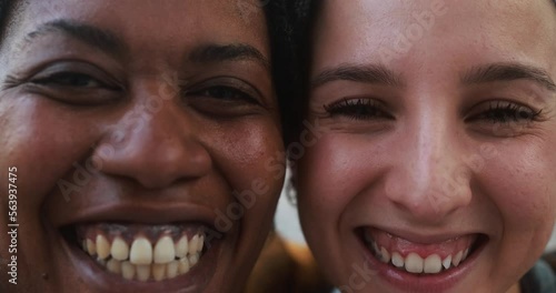 Young mulitracial women smiling on camera photo