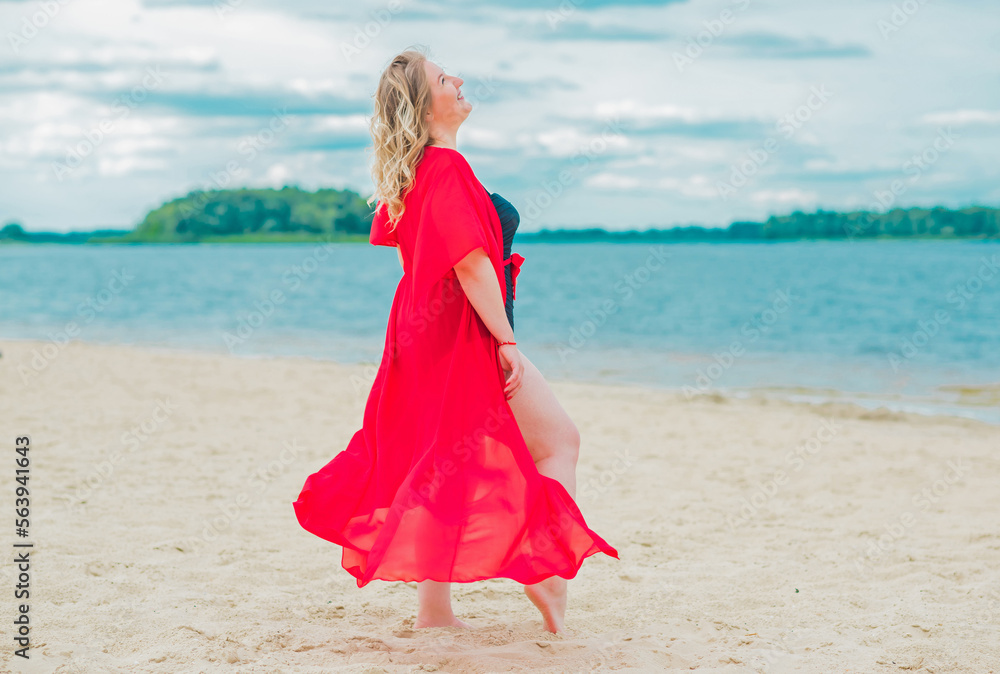 Plus size European blonde woman in stylish romantic women's summer clothes at beach. Concept of sizes, happy nice natural beautiful lady Plus size European blonde woman in stylish romantic women's summer clothes at beach. Concept of sizes, happy nice natural beautiful lady