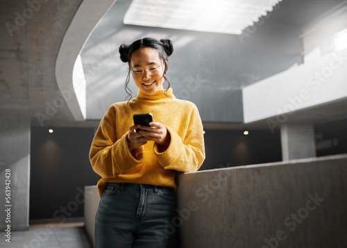 Billede på lærred Happy, woman and texting on phone in office building, relax while on internet, search and reading