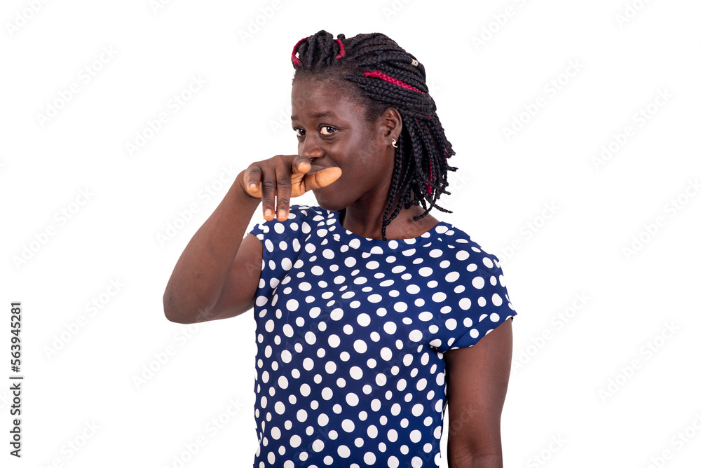 Young woman standing and pointing finger in front of her. Young woman standing and pointing finger in front of her.