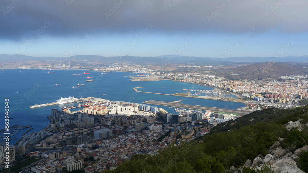the Rock of Gibraltar with La Linea in the background.  Looking down from above