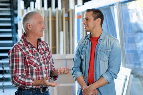 workers talking at a pvc windows factory