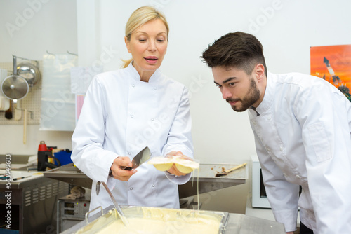 portrait of workers melting white chocolate