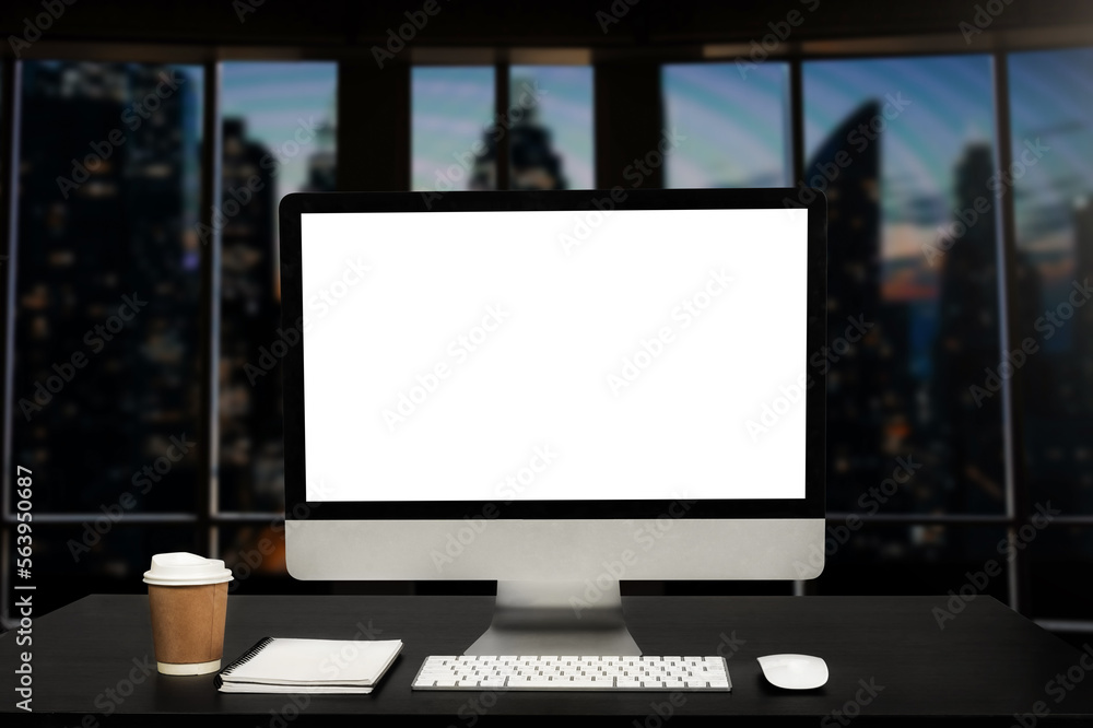 Fototapeta premium Workspace computer putting on wood working desk and surrounded by coffee cup, clipboard, potted plant, stack of smartphone, tablet, and keyboard Orderly office. workspace concept..