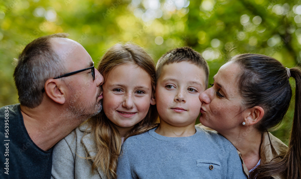 Portrait of happy family with kids in a forest. Portrait of happy family with kids in a forest.