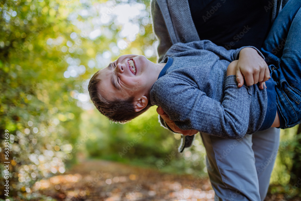 Father having fun with his son in forest. Father having fun with his son in forest.