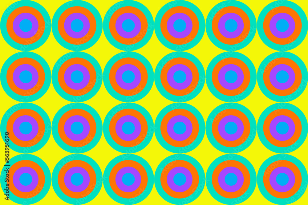 黄色地にエメラルドグリーンやオレンジや紫や青の多重の円形の連なったシームレス模様