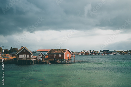 Typical red wooden houses at the harbor, on the Lofoten Islands in Norway - during an beautiful autumn day