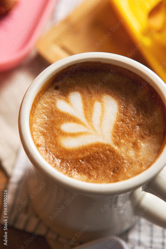 Latte art on a coffee cup Latte art on a coffee cup