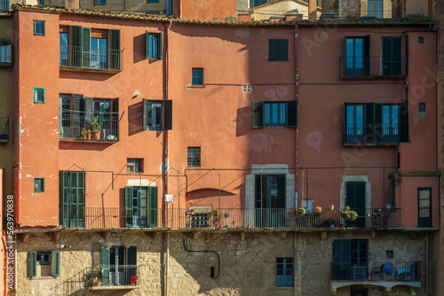 The picturesque streets of Girona city. Old sunny Mediterranean house background.