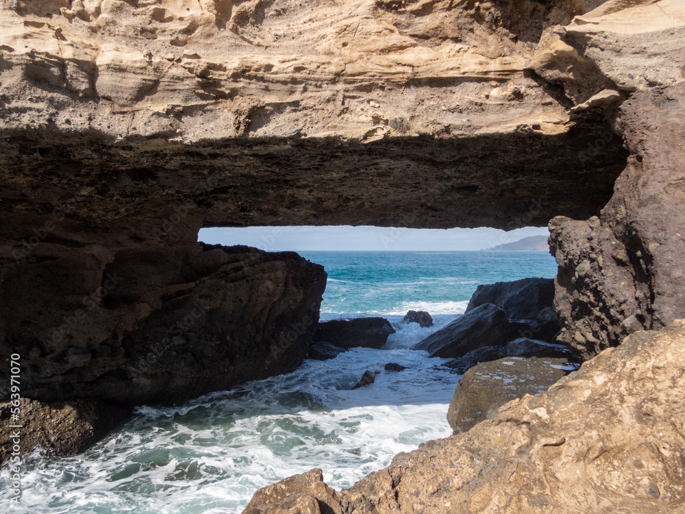 Natural bridge in Puntaguadalupe with waves