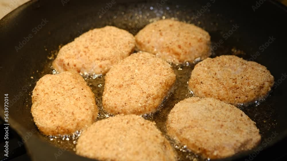 Fried cutlets in a frying pan with sunflower oil. Rustic menu. Traditional rustic food. Close-up. Homemade hamburger cutlets. Fried cutlets in a frying pan with sunflower oil. Rustic menu. Traditional rustic food. Close-up. Homemade hamburger cutlets.