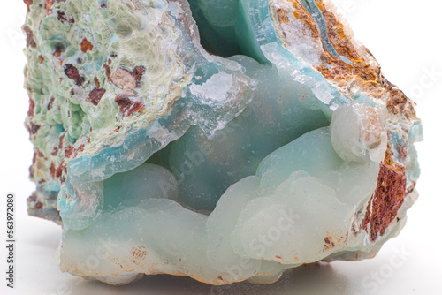 Macro-focused authentic Greek blue, white and brown smithsonite mineral, Glacier-like blue crystal isolated on a white surface background. Close up no shadow.