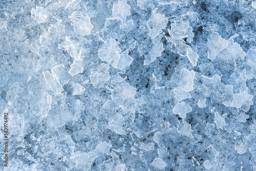 Obraz na plátně Fragments of thin ice, frozen river surface, macro photo