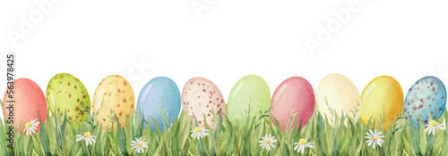 Watercolor vector border with green grass and Easter eggs.