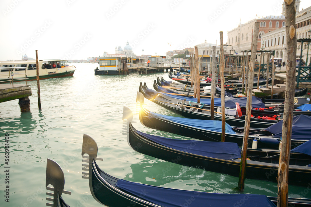 Grand Canal in the morning.Gondolas tied to wooden poles in Venice, Italy. Beautiful romantic italian city.
