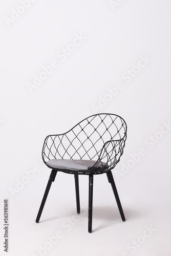 mesh black metal chair with white seamless background