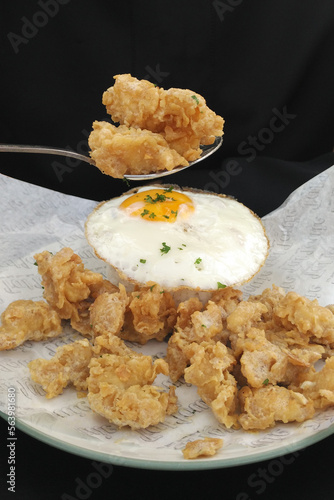 full spoon salted egg fried chicken with sunny side up