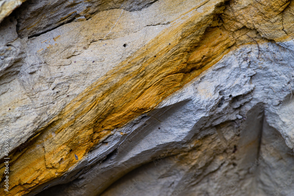 texture of natural sand stone for background Rock formations slice of sand with layers of different structures clay soil. Sand quarry. Picturesque sandstones. mountain closeup. texture of natural sand stone for background Rock formations slice of sand with layers of different structures clay soil. Sand quarry. Picturesque sandstones. mountain closeup.