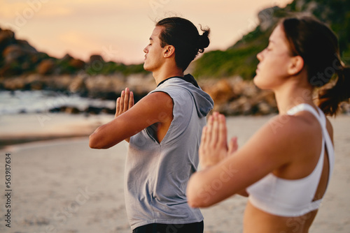 Tela Couple, prayer hands and yoga meditation at beach outdoors for health and wellness