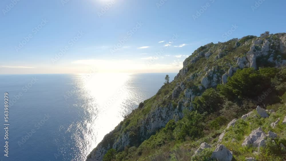 Touristic Town on Capri Island in Bay of Naples, Italy. Sunny Blue Sky. Nature Background. View from top of Mountain. Slow Motion Cinematic Pan Touristic Town on Capri Island in Bay of Naples, Italy. Sunny Blue Sky. Nature Background. View from top of Mountain. Slow Motion Cinematic Pan