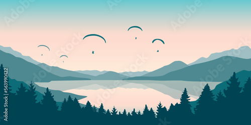 paragliding adventure flying with friends by the lake on mountain background at sunset
