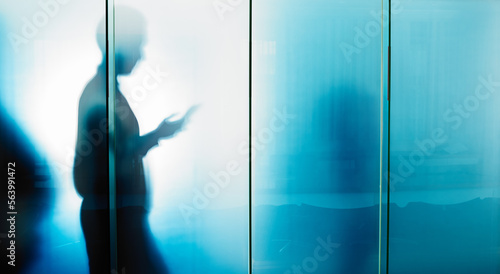 Foto Glass wall, email and businessman reading on a phone for contact, communication and work