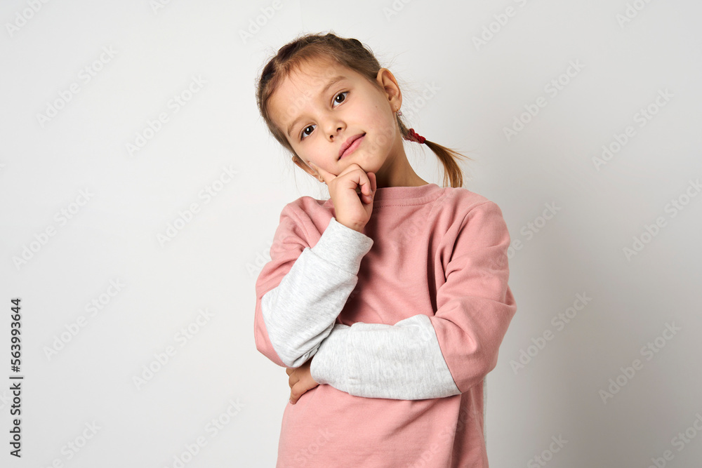 Cute little girl thinking and looking down Cute little girl thinking and looking down