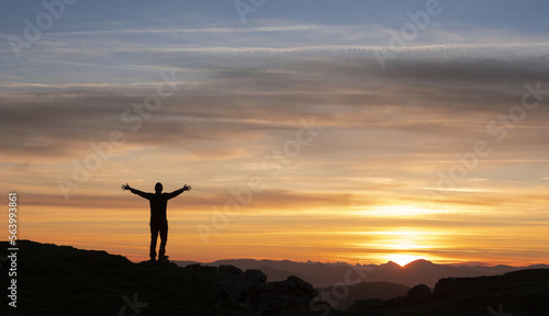 Mountaineer watching the sunrise on Mount Jaizkibel