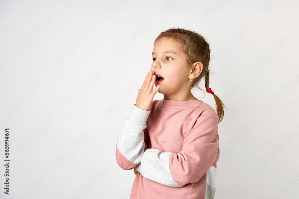 Little cute girl picking her nose, white background Little cute girl picking her nose, white background