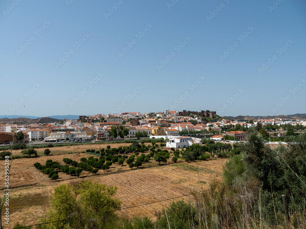 Cityscape of Silves with Moorish Castle and Cathedral on top of the hill, Algarve, Portugal