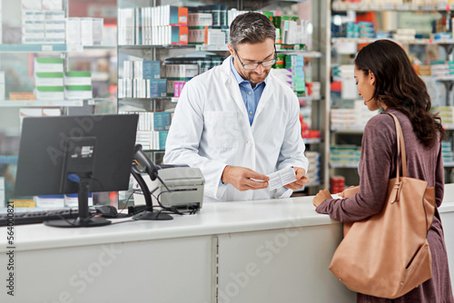 Medicine, service and help of pharmacist consulting at health store counter with expert knowledge. Medication advice and trust of girl with kind worker checking information at pharmacy.