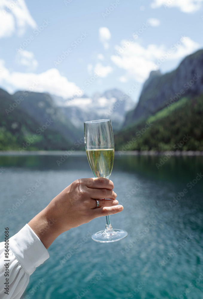a glass of champagne in a woman's hand against the backdrop of mountains and forest, moment, holiday, romance, travel, relaxation, woman, landscape, happy, love, date, mood, lifestyle