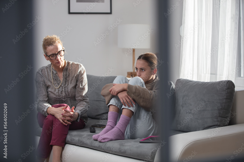 Mother talking with difficult teenager daughter at home. Mother talking with difficult teenager daughter at home.