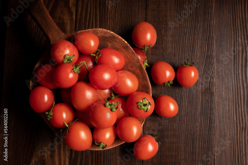 Cherry tomatoes on wooden background