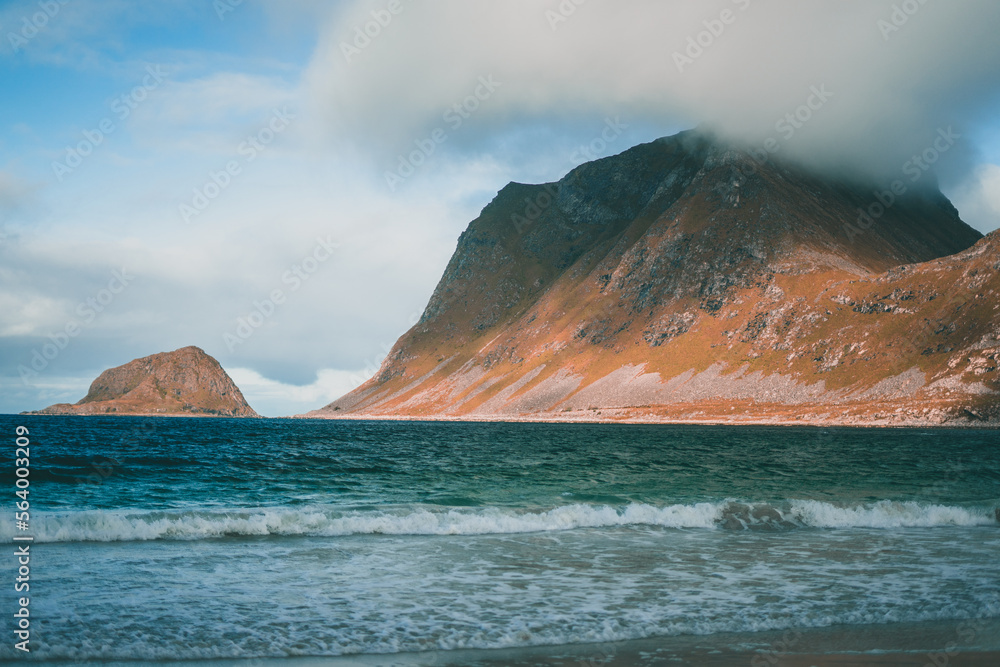 Rough coast on the Lofoten Islands, Norway with some heavy mountains in autumn
