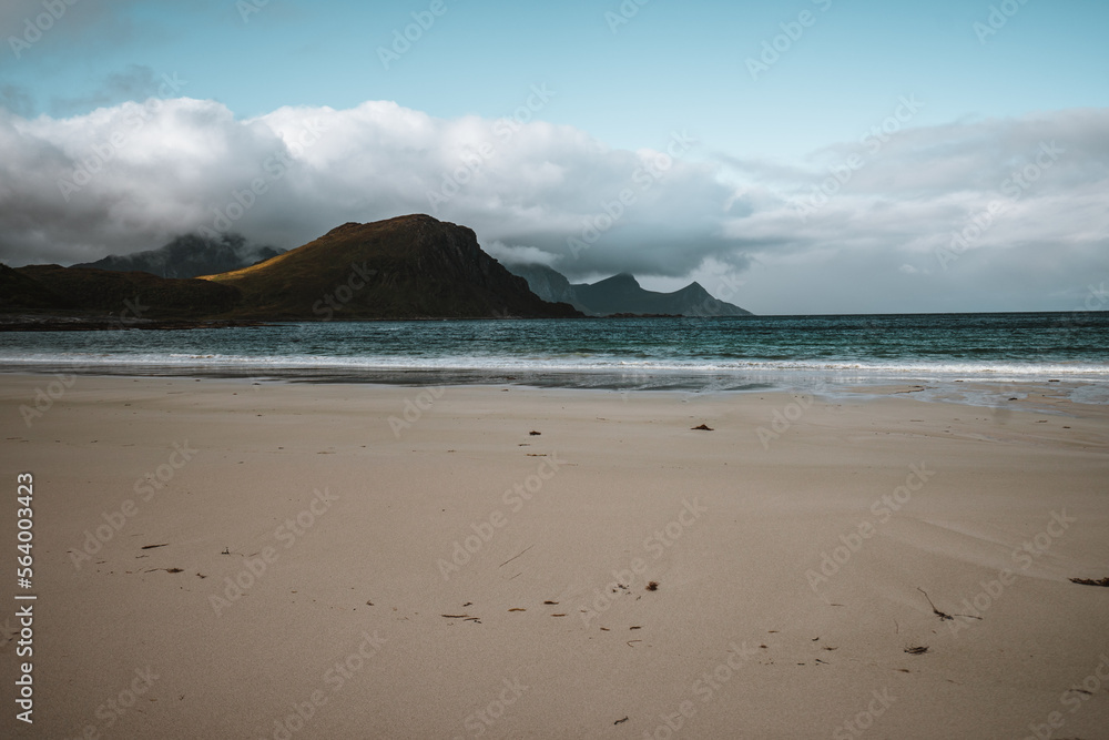 Rough coast on the Lofoten Islands, Norway with some heavy mountains in autumn Rough coast on the Lofoten Islands, Norway with some heavy mountains in autumn