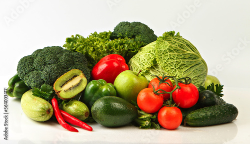 Group of red & green vegetables and fruits isolated on white. Fresh vegetables and fruits