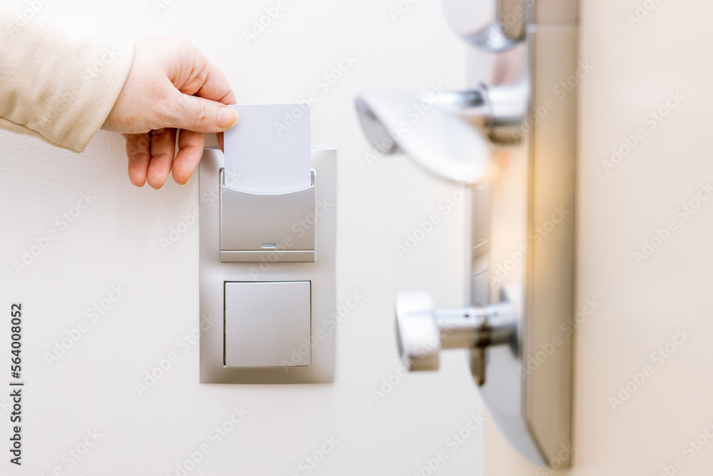 opening the door of a hotel room with an access card opening the door of a hotel room with an access card