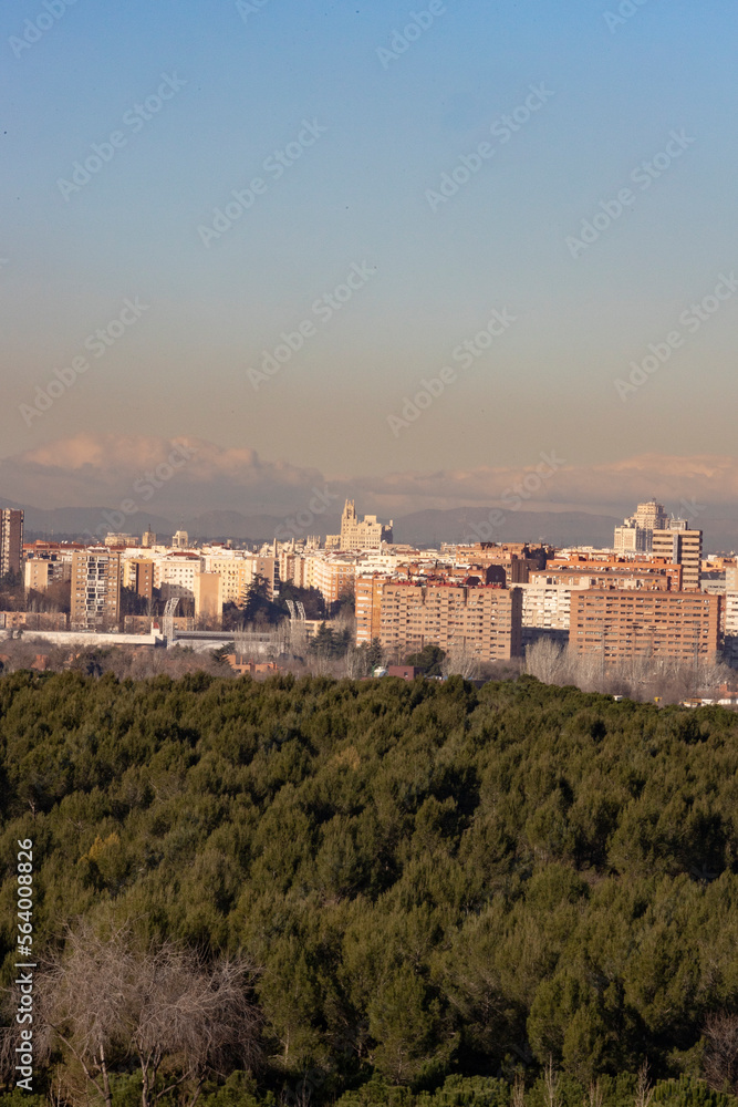 Madrid. Pollution. Contamination. Views of the city of Madrid with a gray and brown layer of pollution beret over the city. Sierra de Guadarrama with snow on the mountain. Photography.