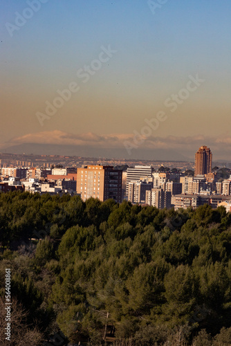 Madrid. Pollution. Contamination. Views of the city of Madrid with a gray and brown layer of pollution beret over the city. Sierra de Guadarrama with snow on the mountain. Photography.