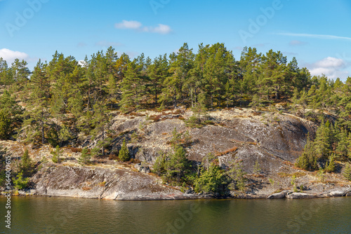 Stockholm Archipelago  view from the cruise ship. Rocks with trees.
