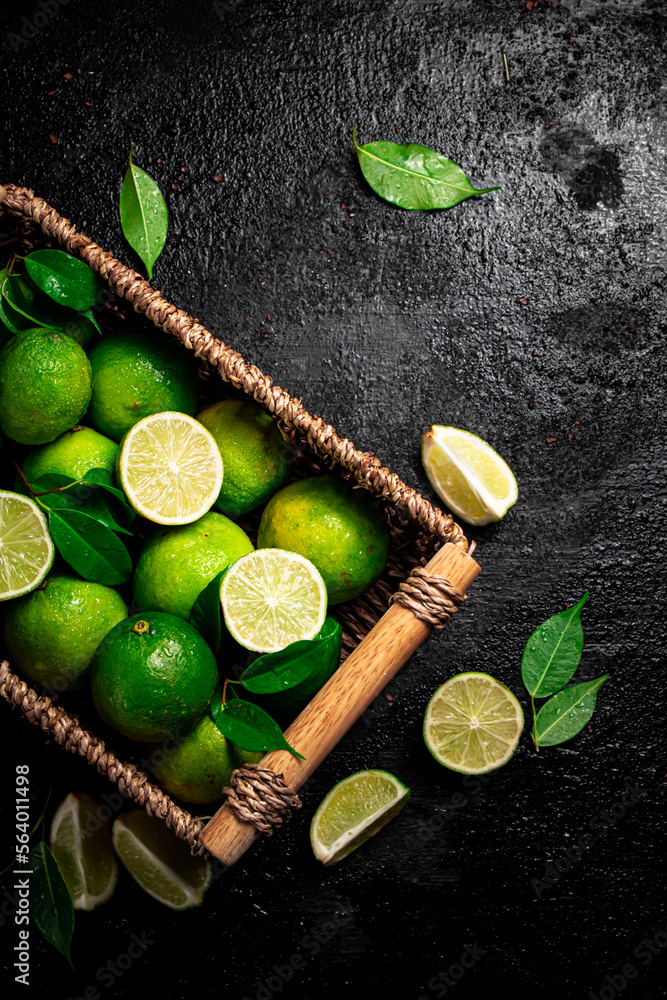 Lime with leaves in a basket. Lime with leaves in a basket.