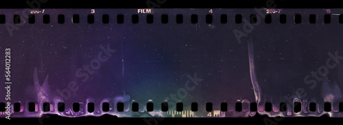 Start or end of 35mm negative filmstrip, first frame on black background, real scan of film material with cool scanning light interferences on the material.