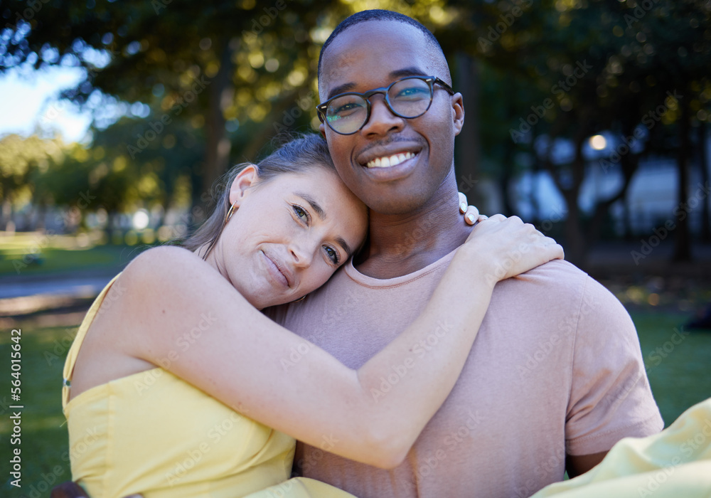 Couple hug in portrait with date outdoor, nature and happy people in interracial relationship with commitment in park. Love, trust and support with black man and woman, smile on face and fresh air